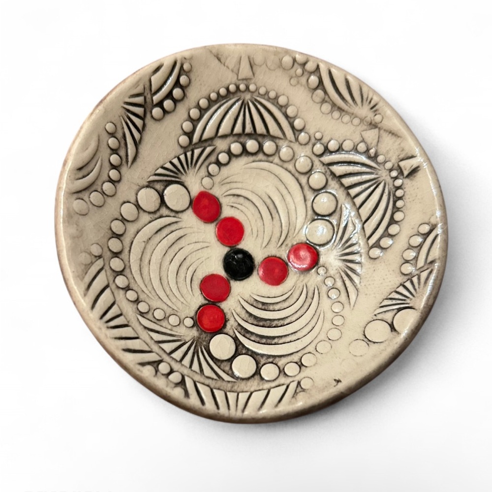 Decorative Ceramic Plate with Red and Black Accents